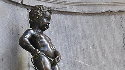 Mannekin Pis Pissing Boy statue in Brussels Belgium